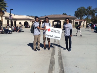 Nikhil Patolia, Harshal Vazha, and Ashray Kapuria (10) show their support for the Red Cross Blood Drive by signing people up every Tuesday and Thursday  in the quad during lunch.