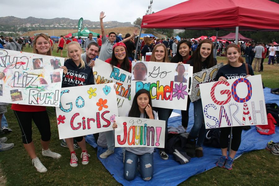 YLHS Womens Varsity Cross Country showing their support for one another. Photo Courtesy of ylhscrosscountry.com.