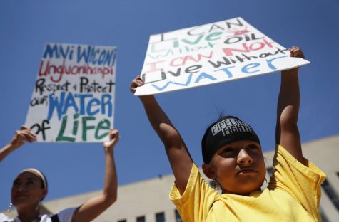 Omaka Nawicakinciji, 7, of the Oglala Lakota Nation in South Dakota, protests the Dakota Access pipeline alongside his mother, Heather Mendoza, in Washington.