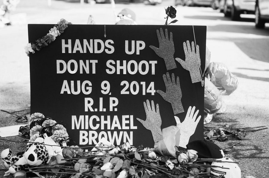 Activists pay respect to Mike Brown at a memorial during a protest.