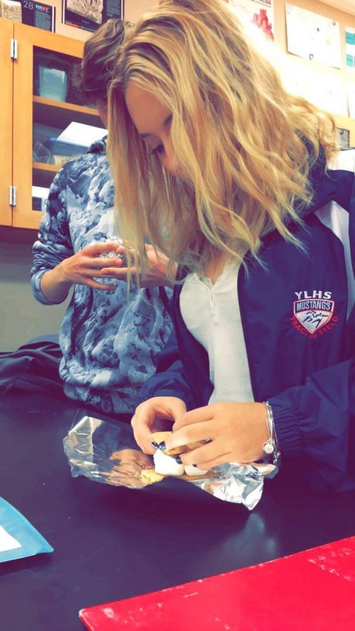 Hailey Denuccio (10) prepares her delicious smore by wrapping it in Tin Foil to make it heat up faster. 
