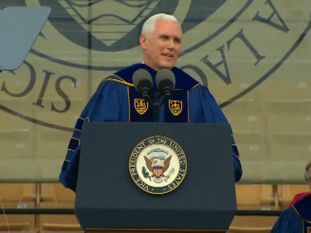 Photo courtesy of South Bend Tribune: Mike Pence spoke at The University of Notre Dame commencement but over 100 students walked out in protest.