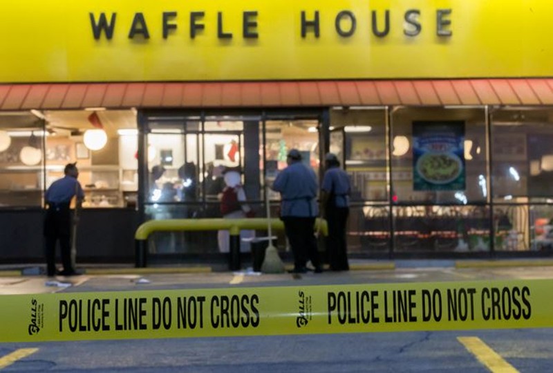 This is a picture of the Waffle House hours after the situation had taken place and the police had arrived. 