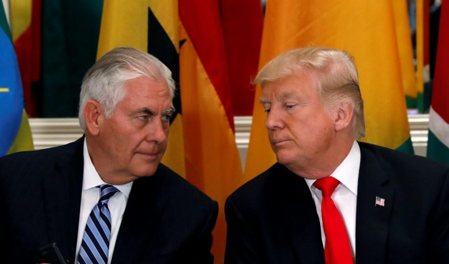 Tillerson and Trump conferring during a lunch conference. 
