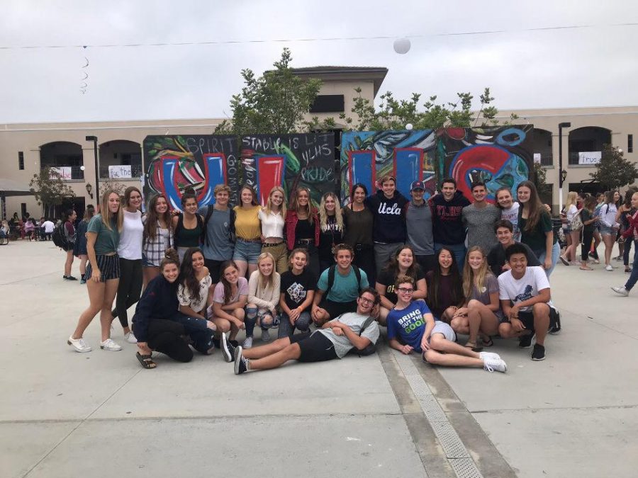 Students kick-off spirit in front of the YLHS chalkboard sign