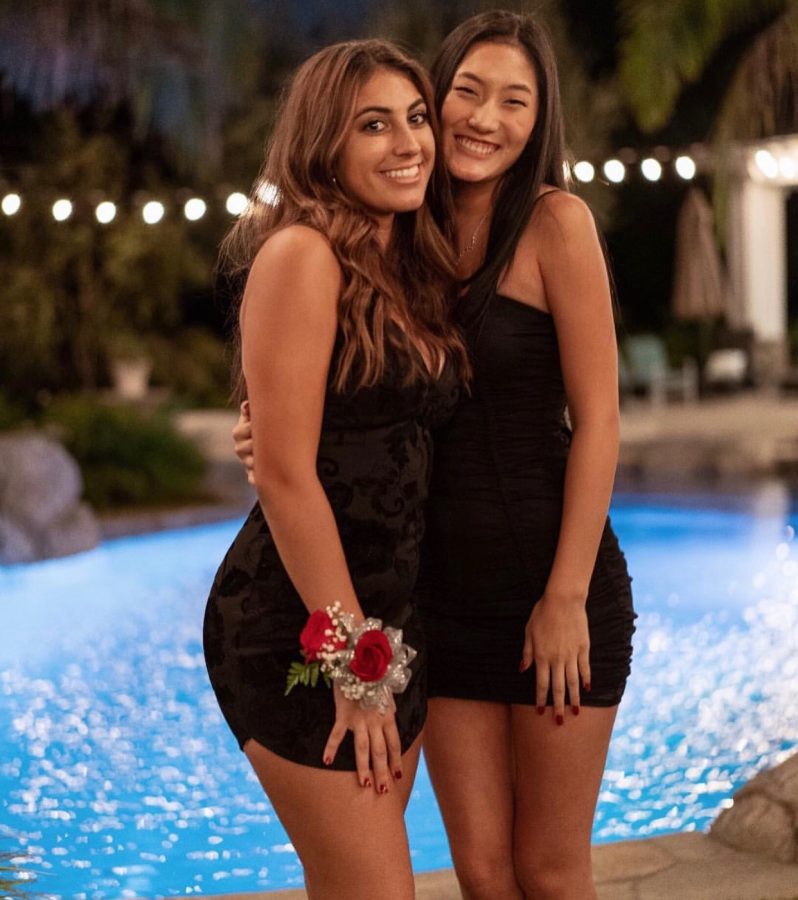 Dani Mallat poses with Priscilla Kim for their homecoming photo. 
