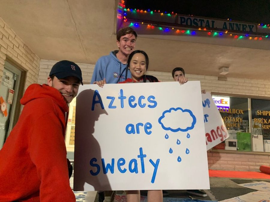 Cheryl Pham and her fellow ASB students work hard to make posters for the annual rivalry football game against the aztecs.