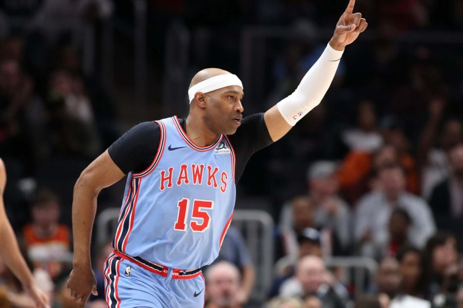 Above, Vince carter celebrates a team win with his team, The Atlanta Hawks.