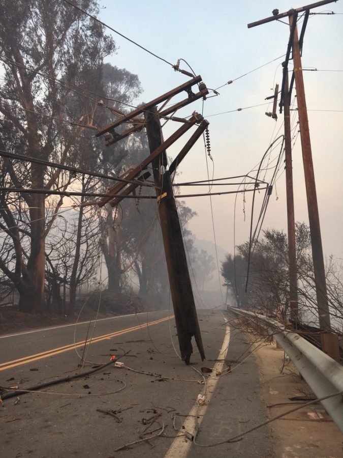 A downed and burnt-through power line lies on Highway 150 close to Thomas Aquinas College, only about a quarter of a mile away from where the Thomas Fire originated in December 2017. 