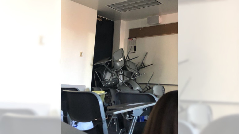 Students stacked chairs to block a door to classroom at CSU Long Beach.