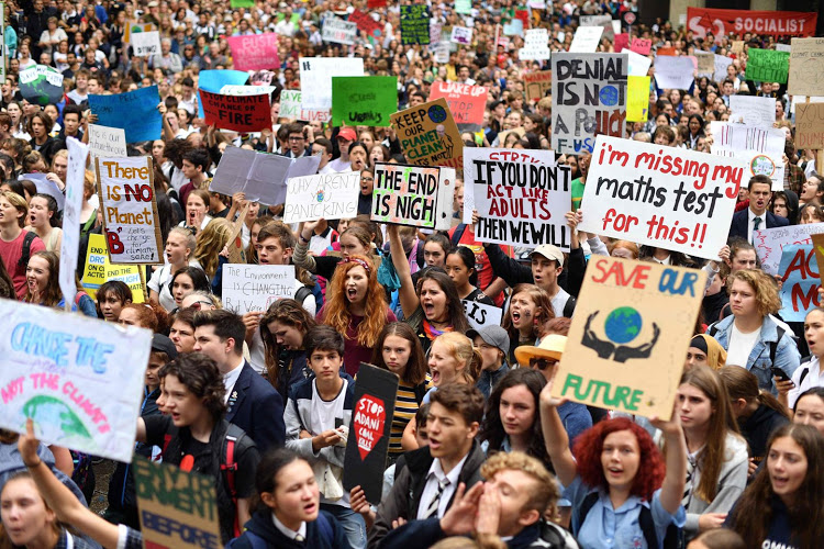 Climate+change+activist+protest+for+change+in+the+streets.