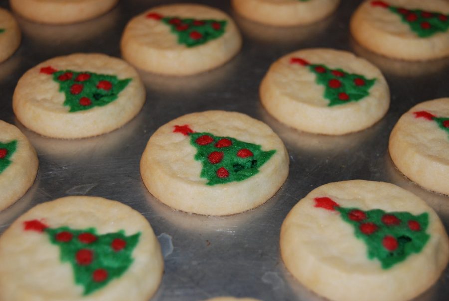 Pillsbury ready to bake Christmas tree shape sugar cookies cool down on the pan.