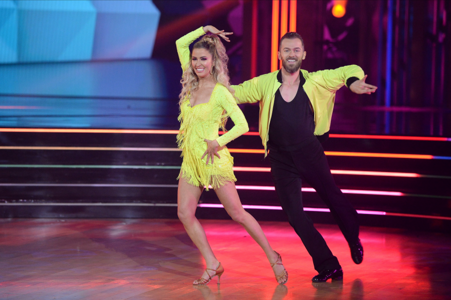 Kaitlyn Bristowe and Artem Chigvintsev deliver their technical cha cha in corresponding neon.