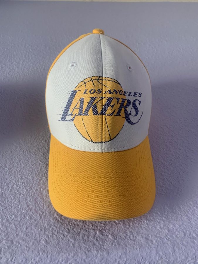 A vintage Los Angeles Lakers hat on display as a decoration. 