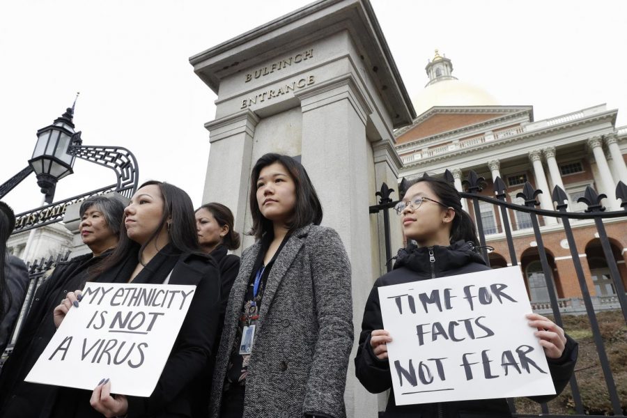 As little has been done when it comes to addressing the rise in hate crimes against Asian Americans, individuals from the Asian American Commission protest on the steps of the State House in Boston. Signs reading “My ethnicity is not a virus” and “Time for facts not fear” solidify the paramount need for accurate information surrounding the recent coronavirus pandemic. 