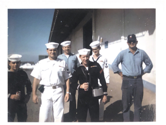 An+image+of+Aquino+and+his+fellow+sailors.+Aquino+stands+second+from+the+left%2C+wearing+all+white.