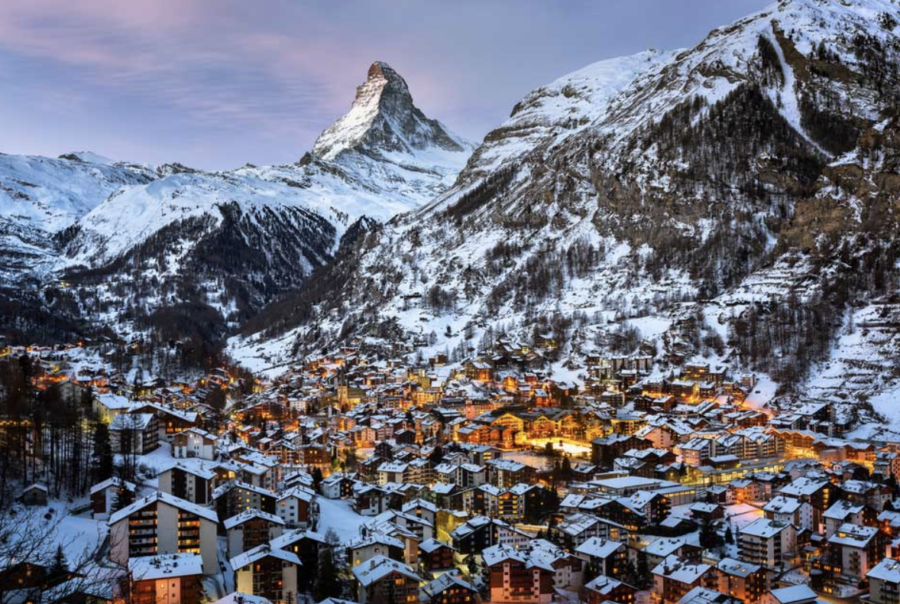 The picture above is a photo of Zermatt, Switzerland, taken just after sunrise. Although Zermatt attracts most of its tourists in the winter, people take advantage of the late Swiss spring, hoping to get the last of the snow before Zermatt becomes a spring tourist attraction again.