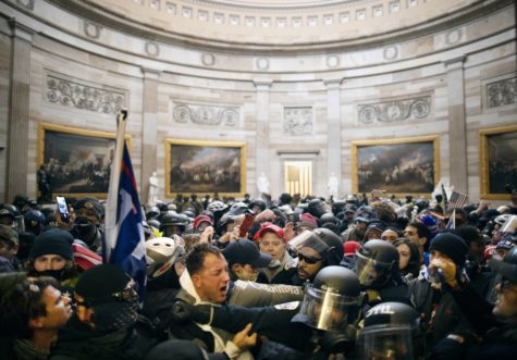 Supporters of former President Trump clash with authorities in the Capitol building’s Statuary Hall.