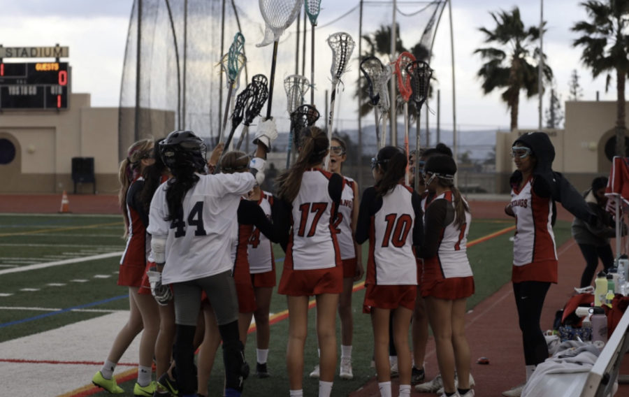 The+YLHS+Womens+JV+Lacrosse+team+breaking+out+of+a+huddle+at+the+end+of+halftime.