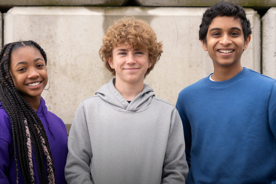 Leah Sava Jeffries (Annabeth Chase), Walker Scobell (Percy Jackson), and Aryan Simhadri (Grover Underwood) pose for a picture for the official cast announcement.