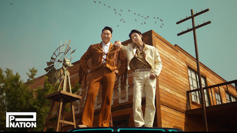 Guess who’s back? Psy poses with BTS Suga in the “That That” MV.