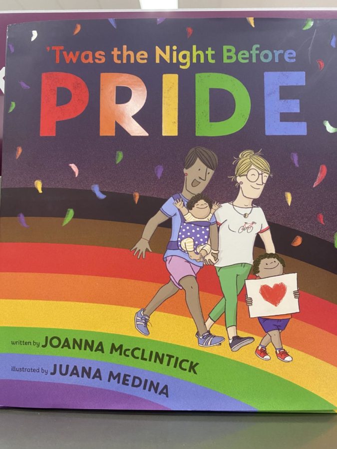 A+children%E2%80%99s+book+depicting+proud+LGBTQ%2B+parents+and+their+children+demonstrates+the+preparations+on+the+night+before+a+pride+parade.