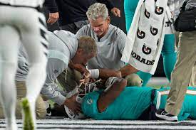 Dolphins quarterback, Tua Tagovailoa, is slow to get up after two hard impacts in a game.
