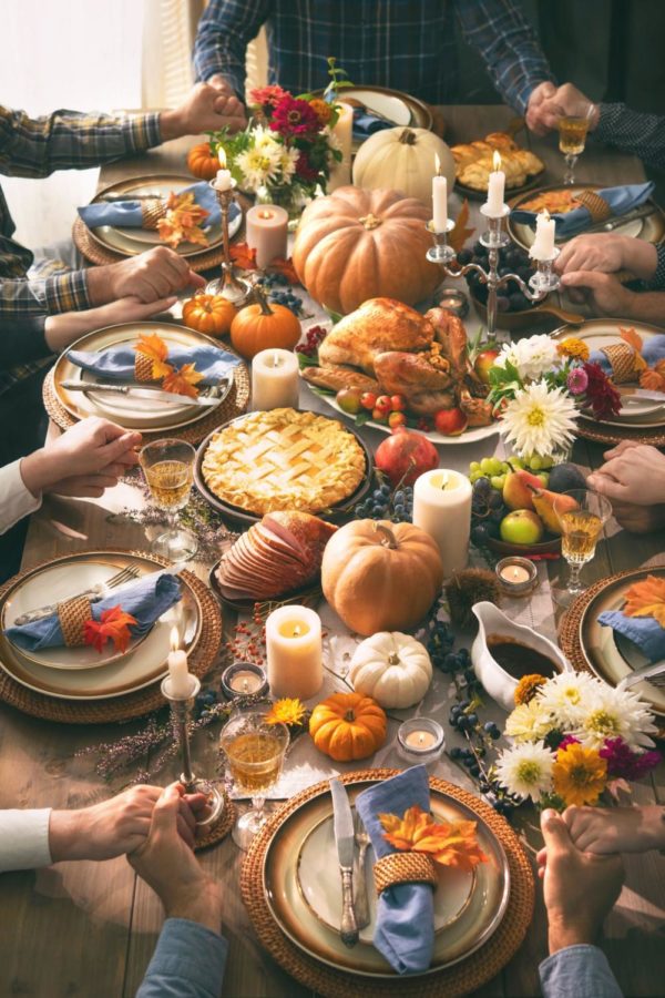 A table gathered together at a Thanksgiving celebration