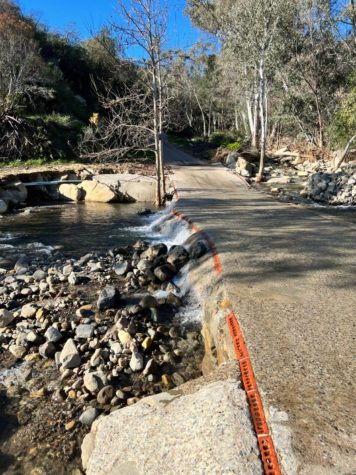 Water from recent rains floods a road in Ojai, California
