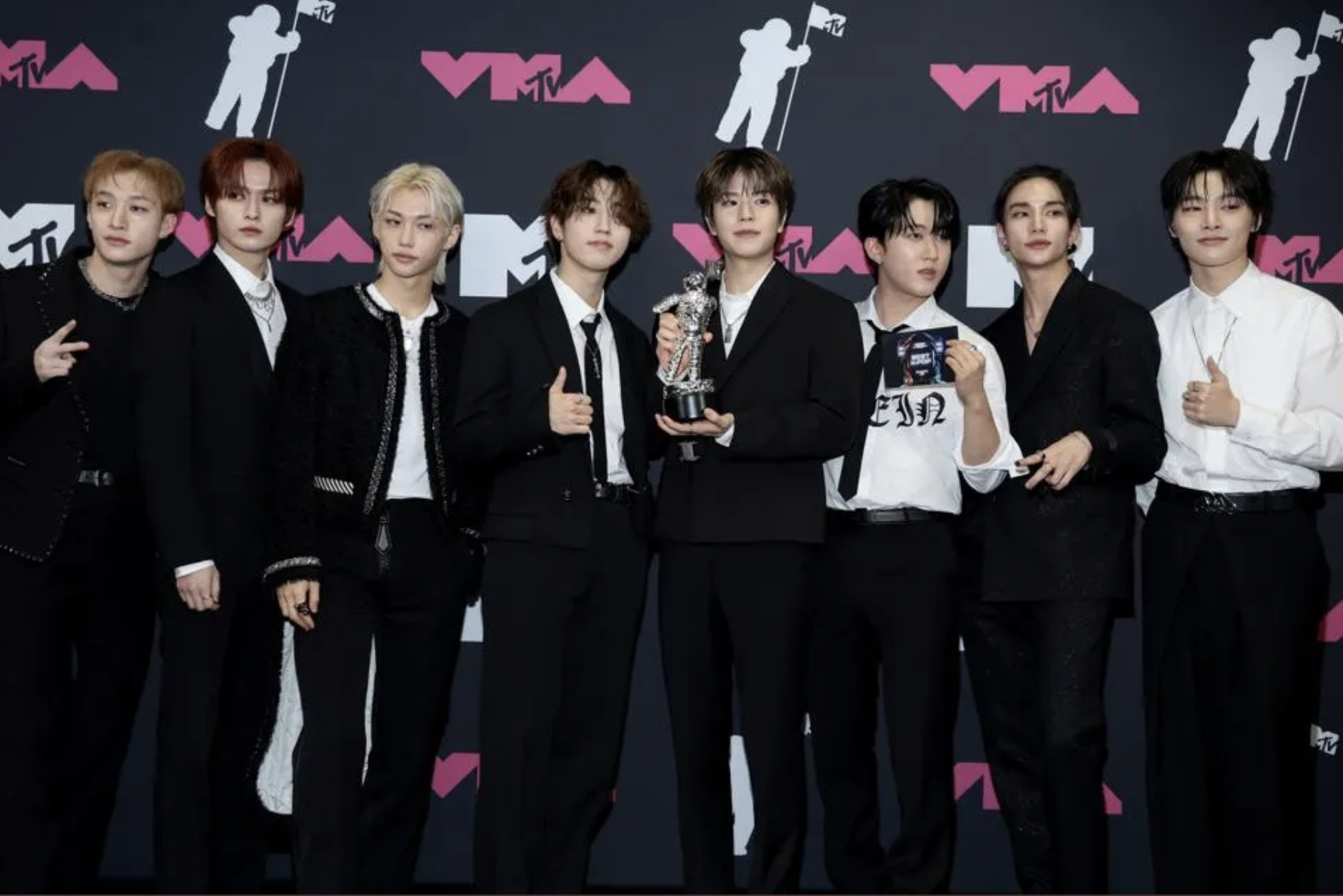 Stray Kids at the VMAs 2023 posing for red carpet after winning their award for Best K-pop 