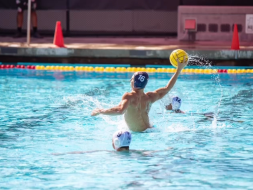 Mens Waterpolo Team Captain: Dylan Armstrong (12) launching the ball at the goal with hopes to score. 