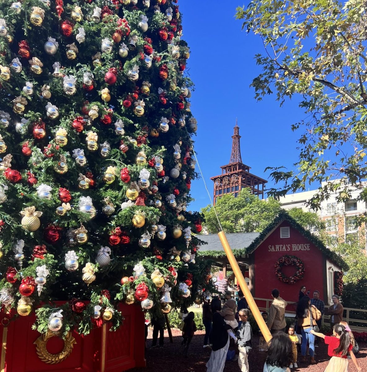 People surround this giant Christmas tree in joy of the upcoming Christmas season