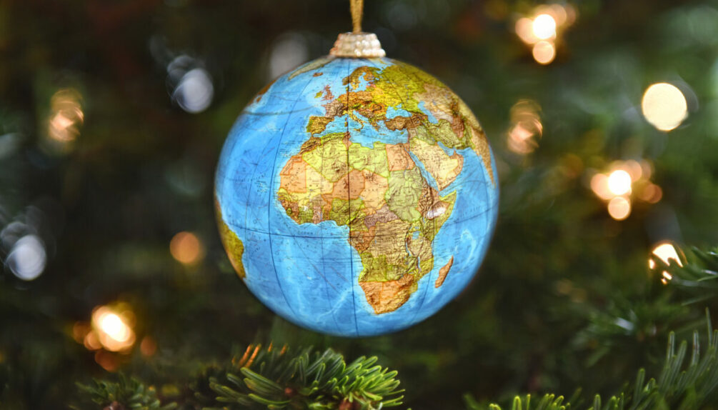 An ornament, a decoration typically used to decorate Christmas trees, with a design of the world map, symbolizing that Christmas is truly a holiday that is celebrated all around the world with so many different traditions.
