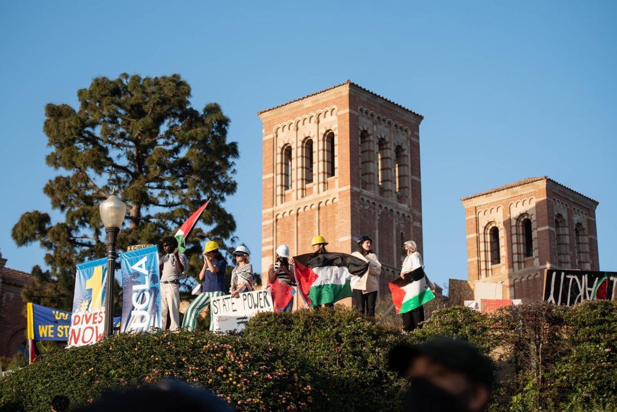 Pro-Palestine protestors display Palestine flags at Royce Hall in UCLA.