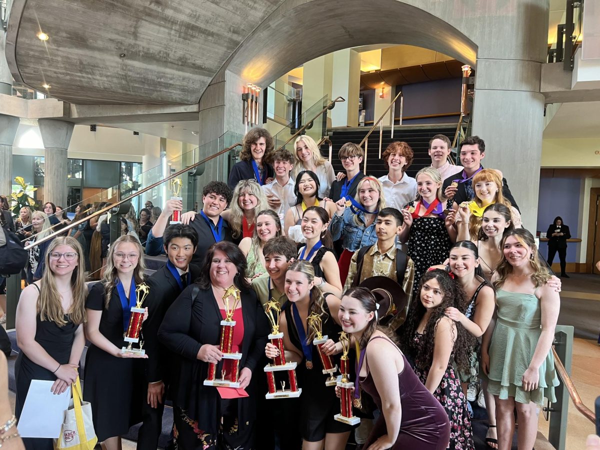 YLHS theatre students stand proud at the Spirit of the MACY Awards with trophies in hand and smiles on their faces.