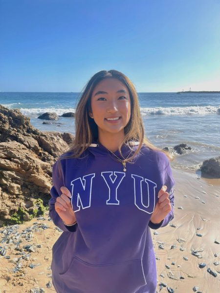 A photo of Casey Cho sporting her NYU gear as she moves on to become a Violet!
