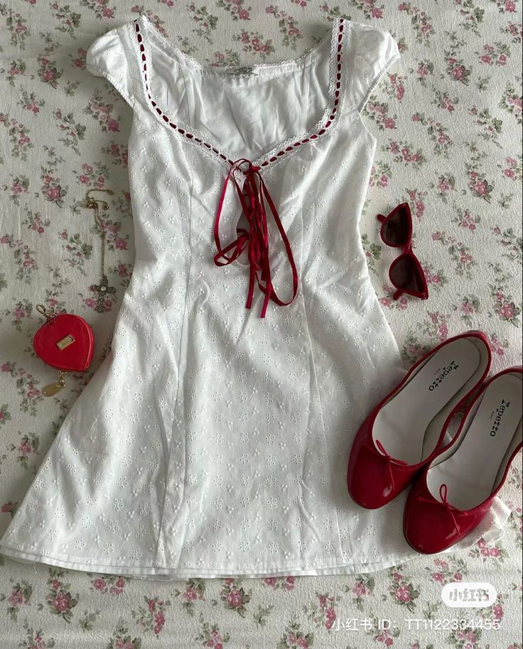 Adding hints of red through your accessories can make a basic dress into a very aesthetic outfit

