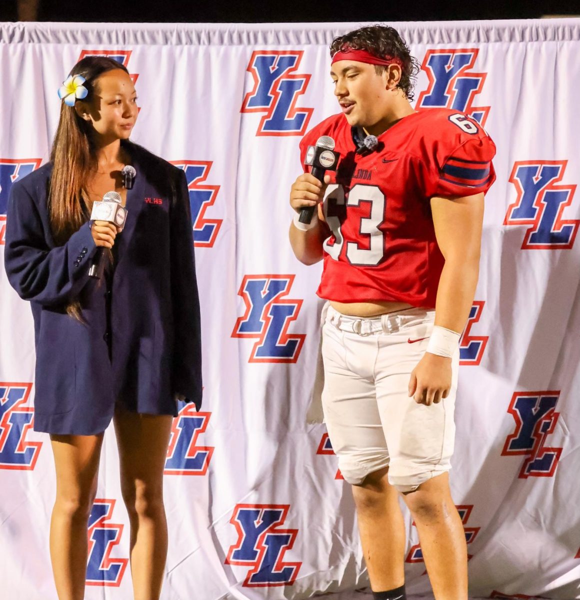 Chloe Chang (12) interviewed Robert Oropeza (12) following their win against Edison.