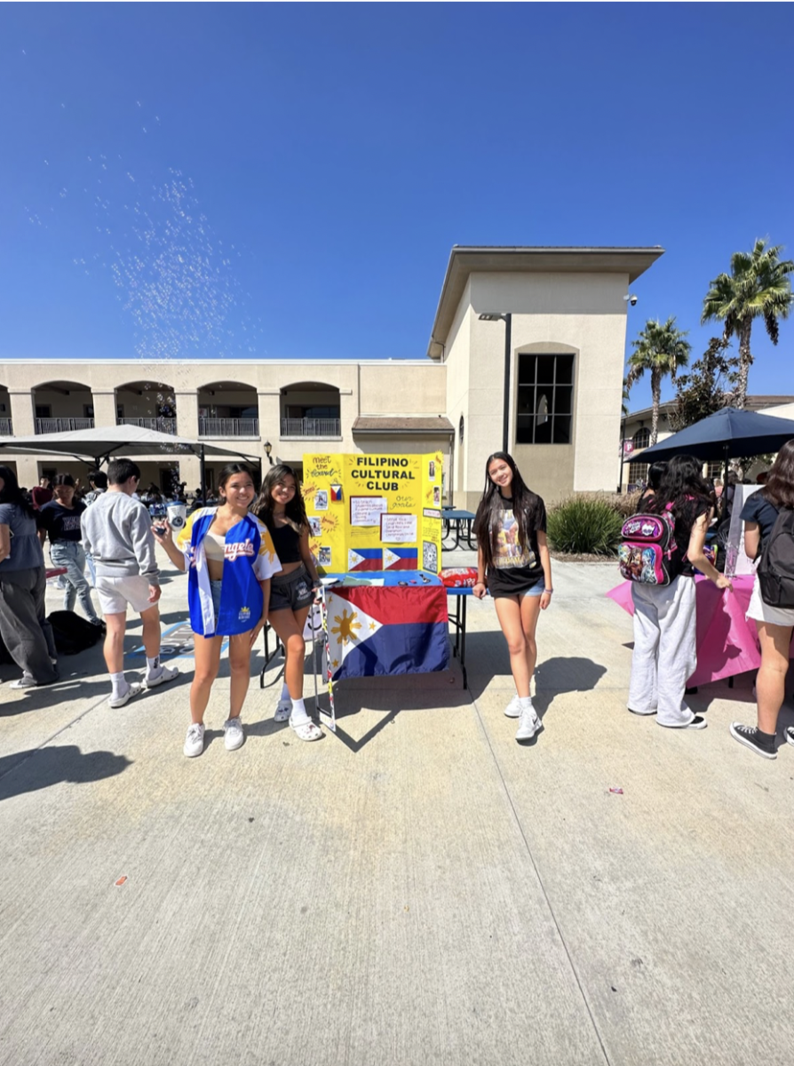 Lauren Urquico, Jennalyn Urquico, and Giana Mejia in front of their stand at their very first club rush in September 2023; eager to start their club together!
