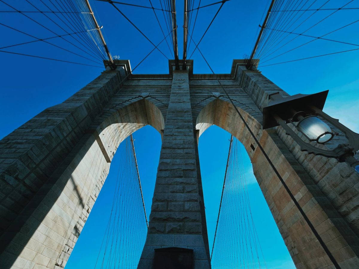 Walking through the Brooklyn Bridge on a vibrant afternoon is something everyone should consider doing
