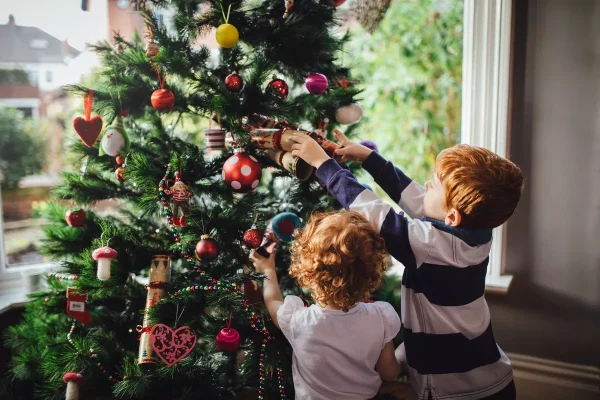  Children ready for Christmas time decorating their tree!
