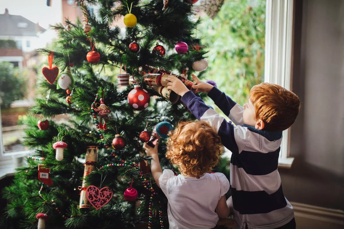  Children ready for Christmas time decorating their tree!
