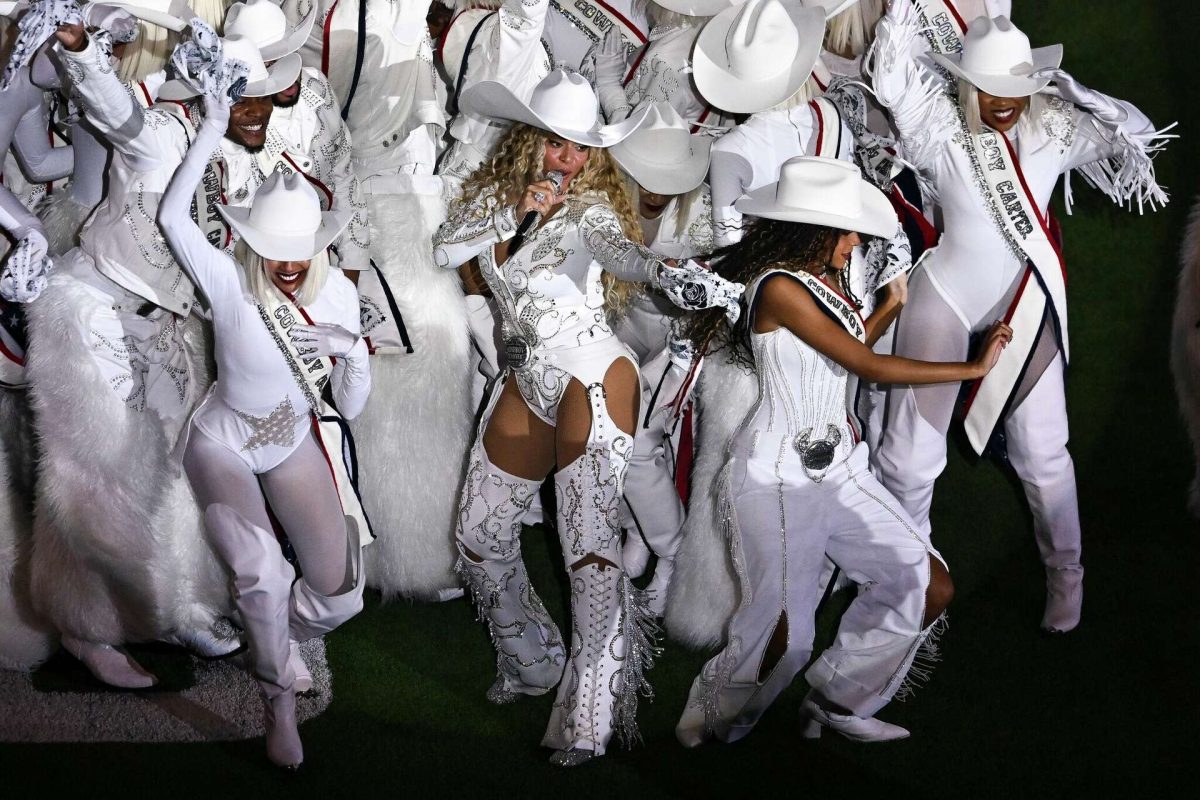 Beyoncé wearing white during her Beyoncé Bowl performance
