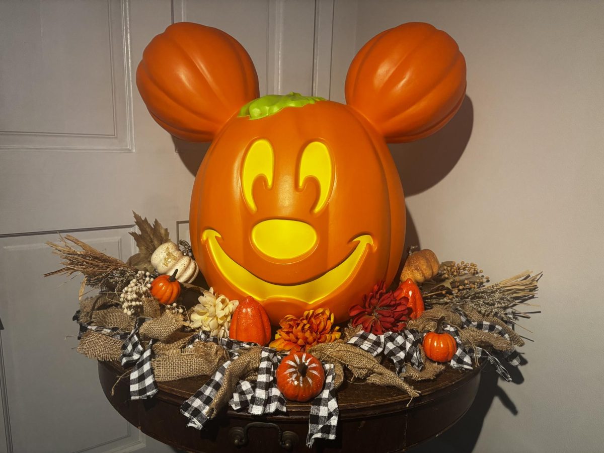 A table nicely decorated in fall decor.