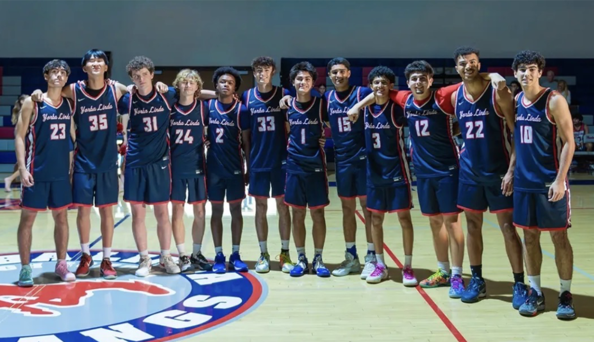 YL boys basketball, taking a picture at Mustang Madness, to showcase the team before the season starts.
