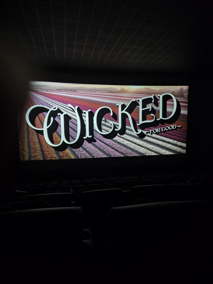Wicked: For Good title screen at a theater, kickstarting the rest of the movie.
