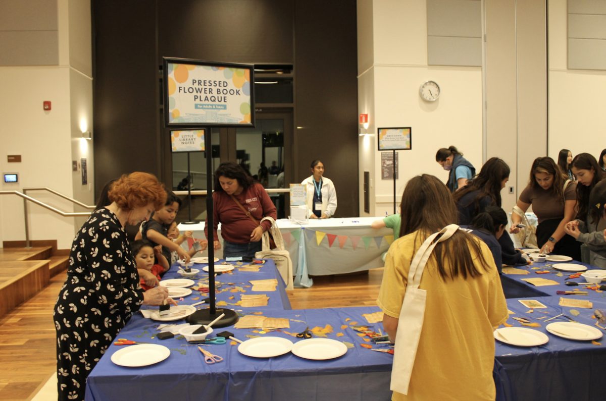 An image taken at the library's 5-year anniversary. The photo shows the pressed flower book plaque, one of the many activities.