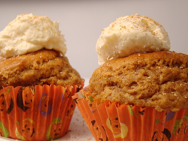 Pumpkin spice embodies feelings of comfort and warmth that are commonly associated with the season. Vegan Bumpkin Pumpkin Spice Cupcake with Tofutti Frosting by Vegan Feast Catering is licensed under CC BY 2.0.