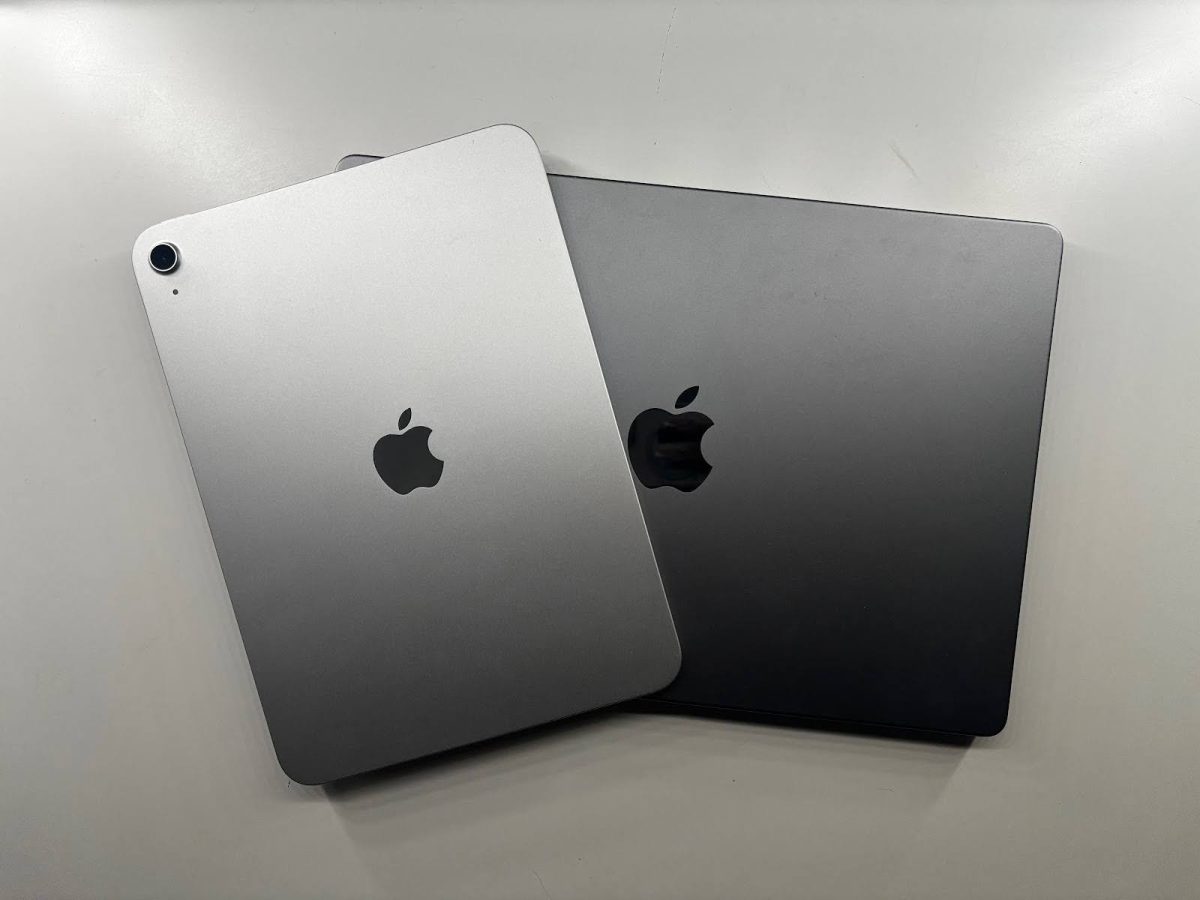 An iPad and a MacBook, side-by-side.
