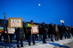 Protesters gather alongside each other asking for justice for Renee Nicole Good in Minnesota.